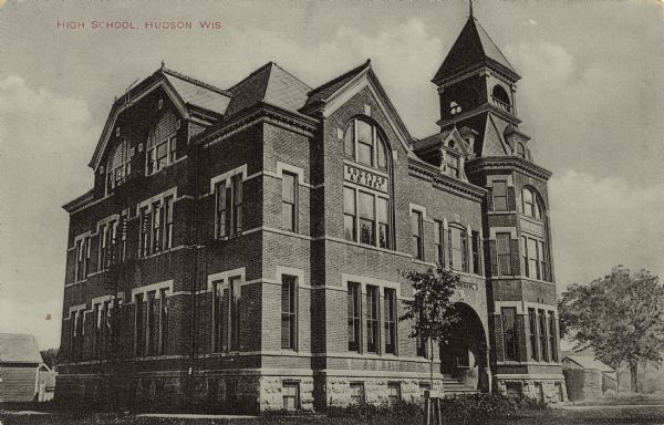 Exterior view from street towards the high school. A date stone above a second floor window reads: "Erected A.D. 1887."