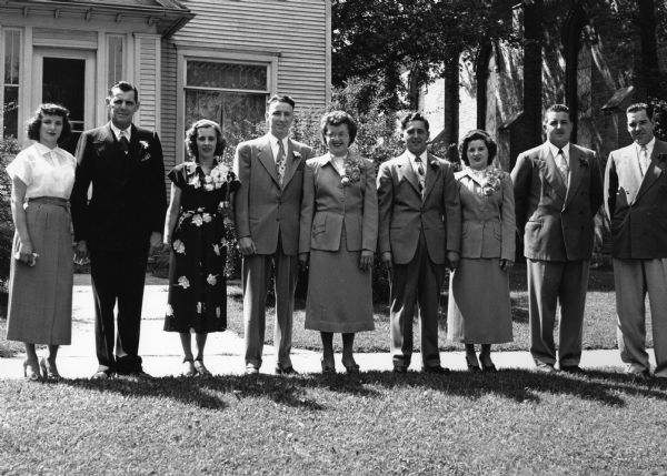 Margie Walsh and Edgar Guelig wedding. Left to right: Katie Walsh, George Kiefer, Mae Walsh Kiefer, Ray and Marie Sauer, groom and bride, Bob Guelig, and Lester Zimmel.