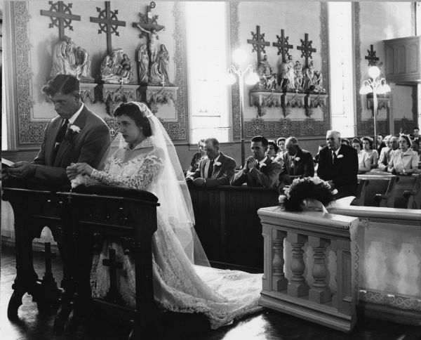 Nancy Allarding and Leroy Koll are united in marriage at Saint Theresa's Catholic Church.