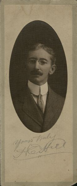 Oval quarter-length portrait of Harry E. Hill, with writing on the back: "To A.C. Miller with treasured memories of years agone. Sincerely H. Hill."