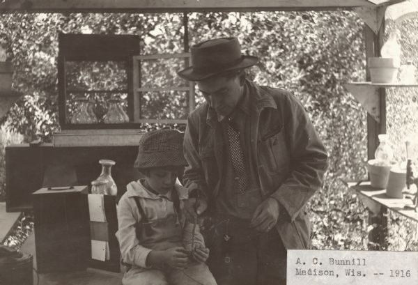 A.C. Bunnill, a beekeeper from Madison, and his child.