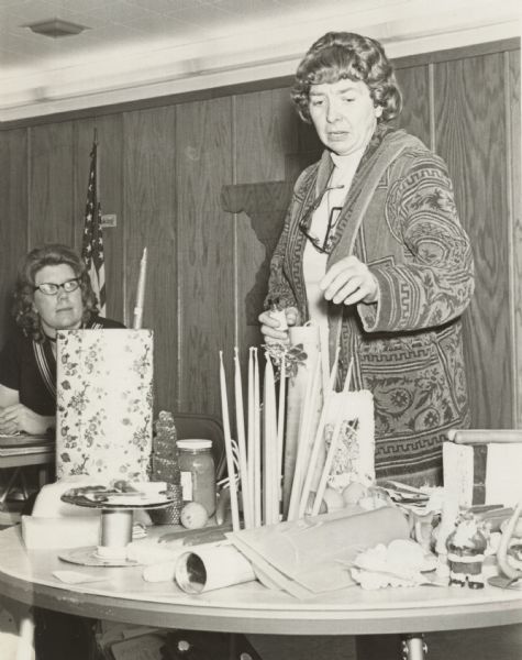 Mrs. Wasilinsky from Cumberland giving a candle making demonstration at the Polk-Burnett County Beekeeper Meeting. Mrs. Weber, Secretary Treasurer in the background.