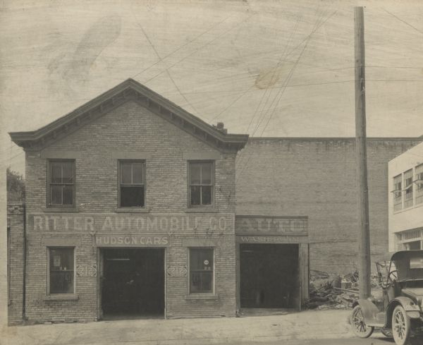 Ritter Automobile Company Exterior view of the Ritter Automobile Company located at 212 S. Pinckney Street. Signs on the front read Ritter Automobile Co., Hudson Cars," and "Auto Wash Room." An automobile is parked on the far right.