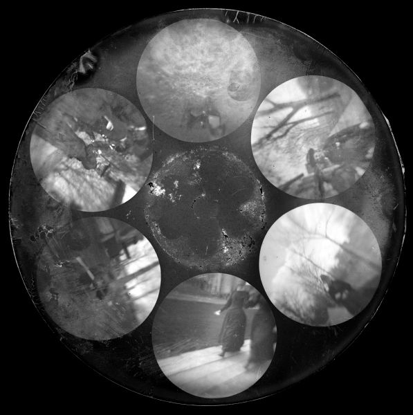 Buttonhole Camera Negative 17 Six circular images on a glass plate negative from the Stirn Concealed Vest Camera. The six images are out of focus. One is of a dog, the others are of men or women posing outdoors.