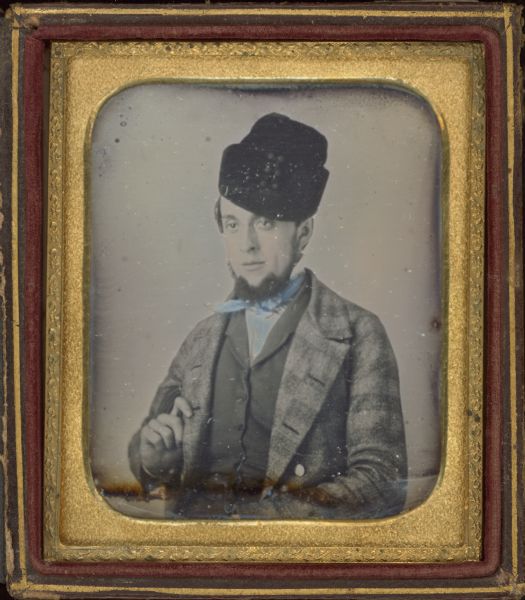 Patrick Henry Smith Sixth plate daguerreotype of Patrick Henry Smith. Waist-up portrait, he is facing slightly right, holding his lapel with his hand. He is wearing a plaid coat, vest, Cossack style winter hat, goatee, and chin whiskers. Hand-coloring on cheeks.