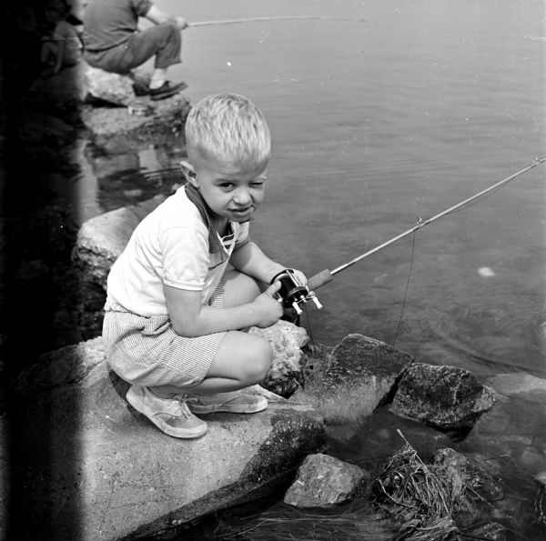 Summer Scenes at Madison Parks and Beaches Jimmy Yerges fishing on the breakwater at Tenney Park.