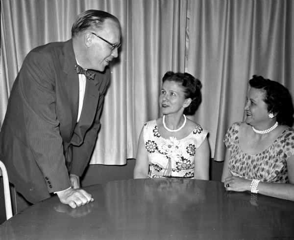 Cosmos Dancing Club Spring Dinner Dance Victor R. Johnson and his wife Stella visit with Madalyn Stolper (right) at the spring dinner dance of the Cosmos Dancing Club at the Nakoma Country Club. Victor Johnson is the retiring board chairman of the Cosmos Dancing Club.