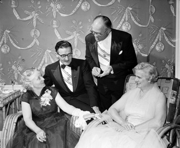 Knights of Columbus Formal Spring Dance Hosts and hostesses for the Fourth Degree Knights of Columbus party include (left to right) Gertrude Gill, Bernard Gill, Michael Hielmeier (Ft. Atkinson), and Mrs. Heilmeier.