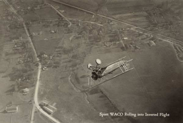 Sport WACO Rolling into Inverted Flight Aerial view of a WACO ATO (also known as 10-T Taperwing) rolling into inverted flight. The airplane is powered by a 220hp Wright J-5 motor.