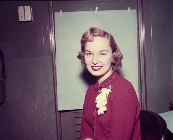 Unidentified Female Employee Portrait of an unidentified female employee wearing a red dress and a corsage.