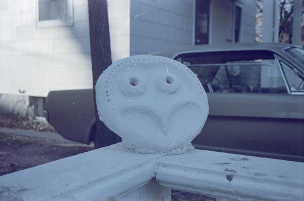 Face Disk Sculpture Face Disk sculpture outside Sid's house.