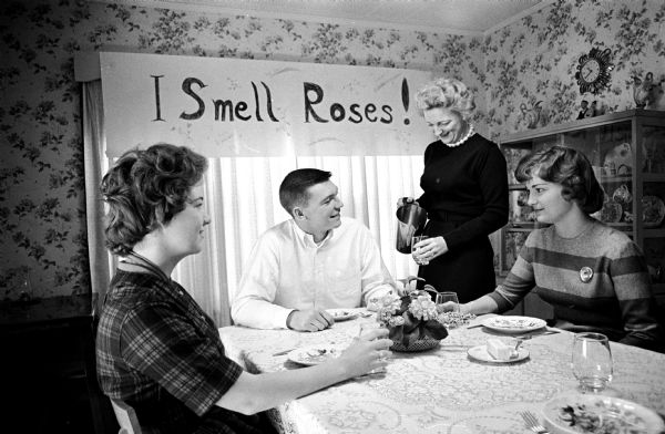 Pat Richter Pat Richter and his sisters, Jane, left, and Randi along with their mother Mary eating breakfast before the Minnesota football game. The neighbors were responsible for the "I Smell Roses!" sign behind them.