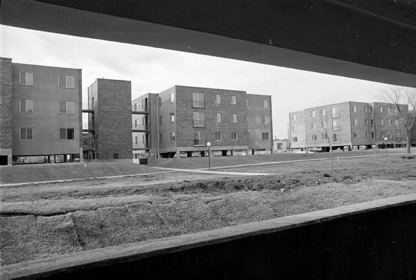 Sampson Plaza Apartment Complex View of the Sampson Plaza apartments from the inner courtyard. The 10 buildings feature ground-level parking under the buildings and elevator towers between each pair of buildings and are located adjacent to Brittingham park between West Washington Avenue and Main street.