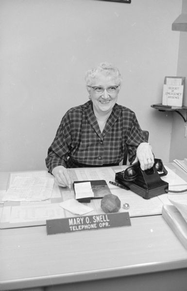 Post Office Telephone Operator Mrs. Mary Snell who has been the post office telephone operator for almost 19 years. She answers complaints, refers calls, and gives information for hundreds of calls a day.