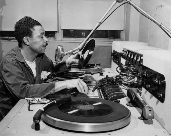 Alvin Benson, VA Hospital Alvin Benson playing records to broadcast over the radio at the VA Hospital.
