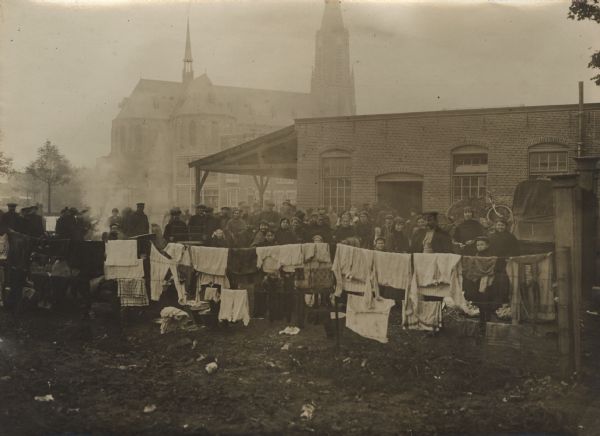 Group of Belgian Refugees A group of Belgian refugees posing for a group portrait in the churchyard.