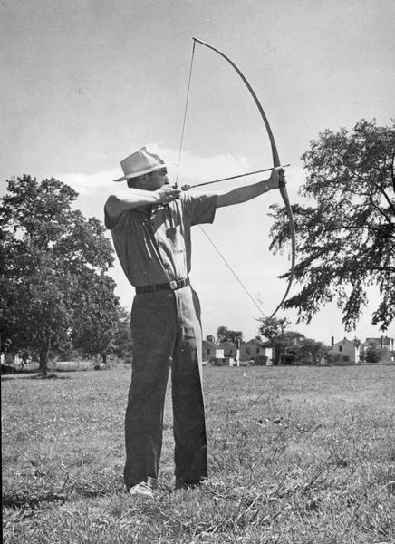Man holding bow during archery practice.