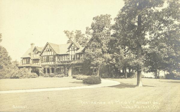 Outdoor view of the residence of Mr. J.V. Farwell, Jr. A curved drive is leading up to the house, which is surrounded by trees and shrubs. Caption reads: "Residence of Mr. J.V. Farwell, Jr., Lake Forest, Ill."