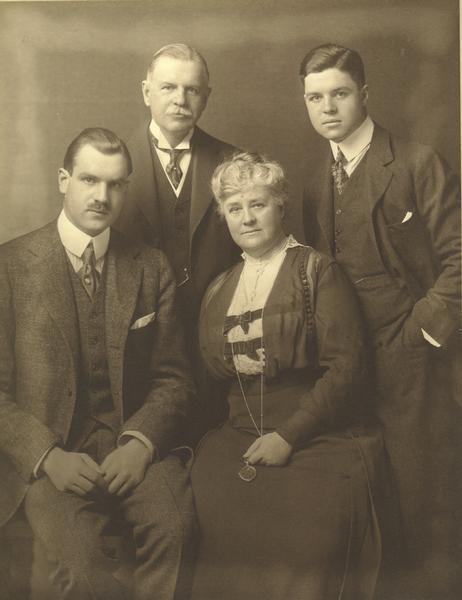 Formal studio portrait of Cyrus Hall McCormick, Jr., his wife, and their two sons. McCormick was president of the McCormick Harvesting Machine Company from 1884 to 1902, and president of the International Harvester Company after 1902.