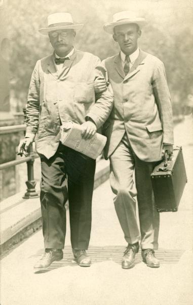 Arm in arm, Socialist Victor Berger and colleague Robert Hunter take a stroll in downtown Milwaukee.