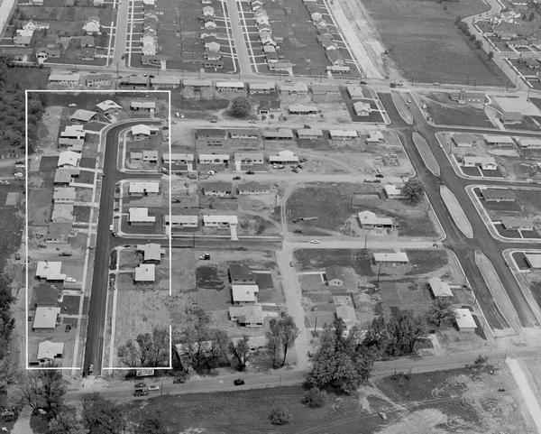 Aerial view of Midvale neighborhood under construction near Madison's southwestern city limits. The view is focused on the area bounded by Tokay Boulevard, Midvale Boulevard, and Odana Road, with a block of homes along Odell Street featured in the 1955 Parade of Homes marked with a white boundary.