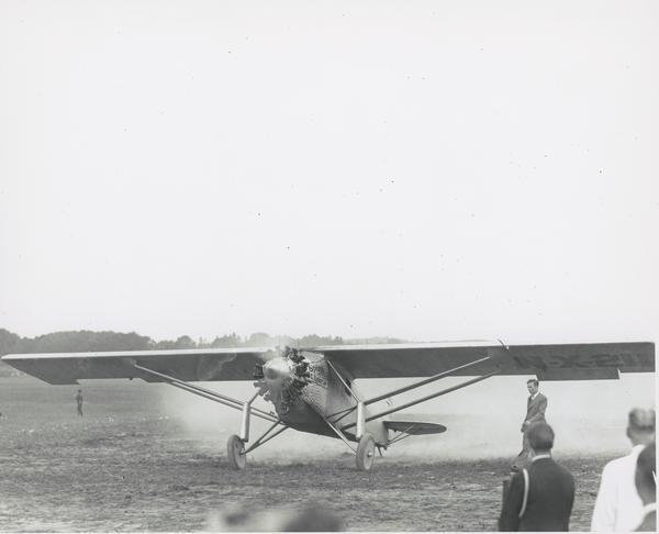 Charles Lindbergh landing the <i>Spirit of St. Louis</i>, a Ryan NYP at Pennco Field (Royal Airport). This stop was one of only two appearances made in Wisconsin during Lindbergh's triumphant national tour.