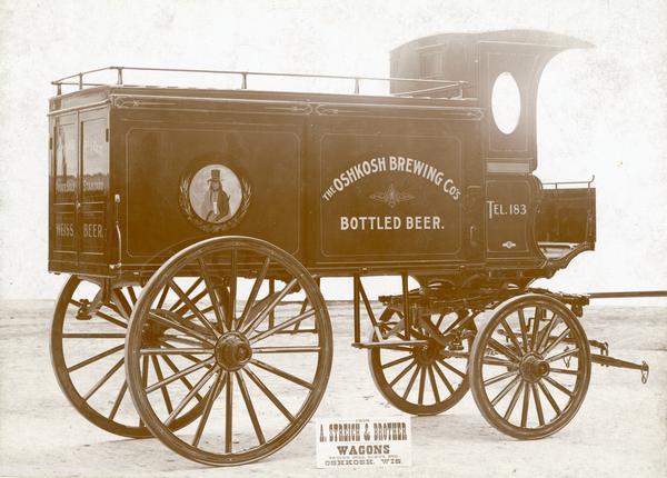 Side view of an Oshkosh Brewing Company wagon built by A. Streich & Brother Wagons.