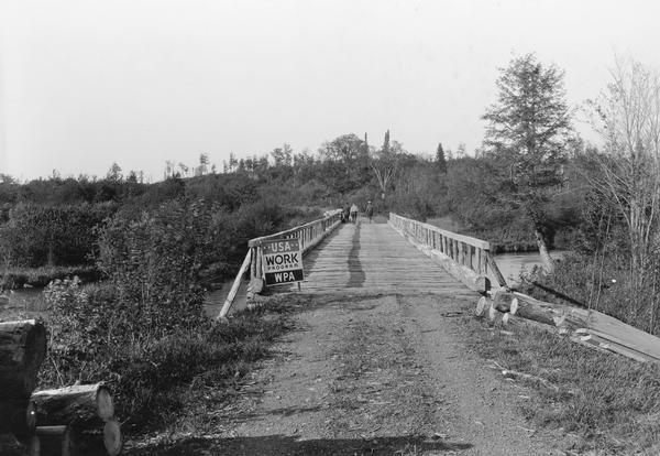 Bridge and truck trail constructed by Works Progress Administration (WPA) workmen to facilitate forest fire prevention and control.