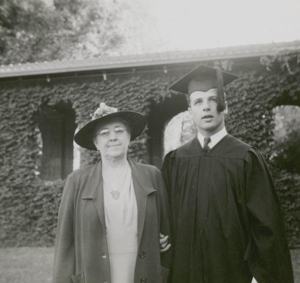 Gaylord Nelson, dressed in cap and gown, poses with his mother Mary Nelson at his graduation from San Jose State College in 1939.