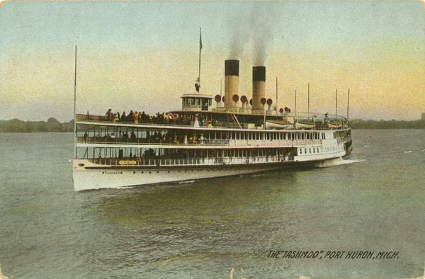 View across water toward the left side of the sidewheel. Caption reads: "The 'Tashmoo,' Port Huron, Mich."