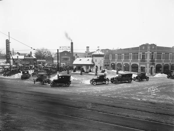 Pennsylvania Oil Company Service Station Elevated view of cars lining up at Pennco filling (gas) station at the corner of State and Gorham Streets to get free crankcase draining and "Oak" Motor Oil offered during a winter cold snap.