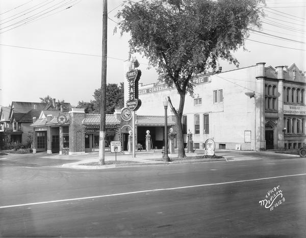 A Texaco service station located on the corner of University Avenue and Lake Street. The station replaced a home laundry service pictured in a 1927 McVicar photograph of the same corner. Also included is the Wheeler Conservatory of Music, 626 University Avenue. Text with print reads: "Texaco Station, Capital Super Service, 630-32 University Avenue, Wheeler Conservatory of Music, 626 University Avenue."