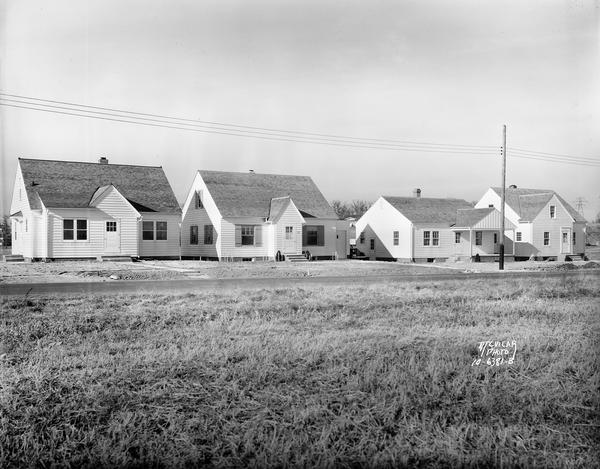 A row of houses at 826, 830, 834 & 838 North Fair Oaks Avenue built by the Fitzpatrick Lumber Company in what was the Town of Blooming Grove, now near East Washington Avenue.