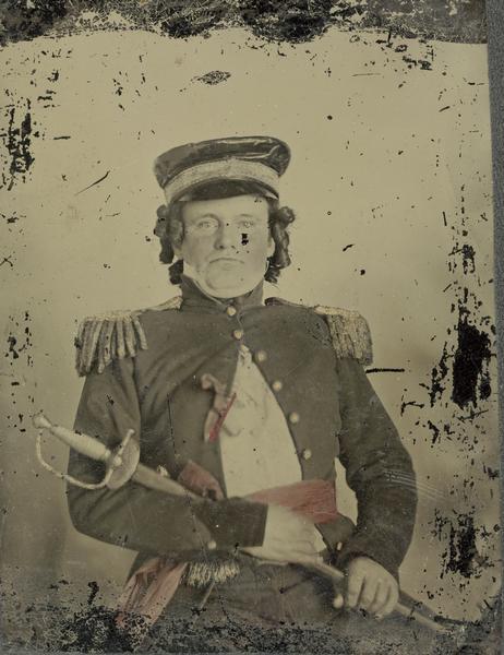An actor dressed as an army officer, holding a saber, for the performance of "Black Hawk, or Lily of the Prairie," a drama written by Mary Elizabeth Mears of Fond du Lac, Wisconsin, and presented in Madison, Wisconsin in 1857.