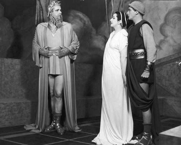 Barry Thomson, Lynn Fontanne, and Alfred Lunt as Jupiter, Alkmena, and Amphitryon.