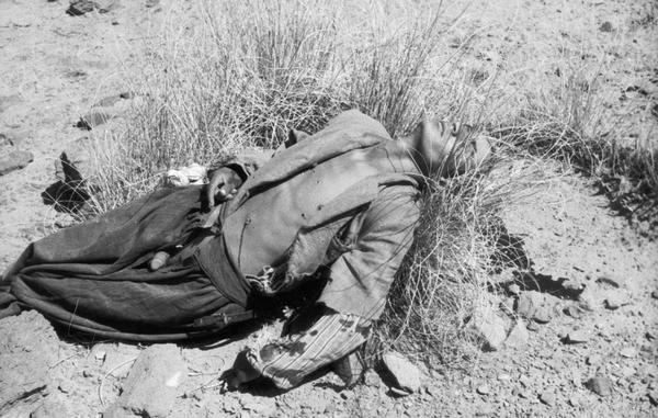 Executed man on ground. Algeria.
