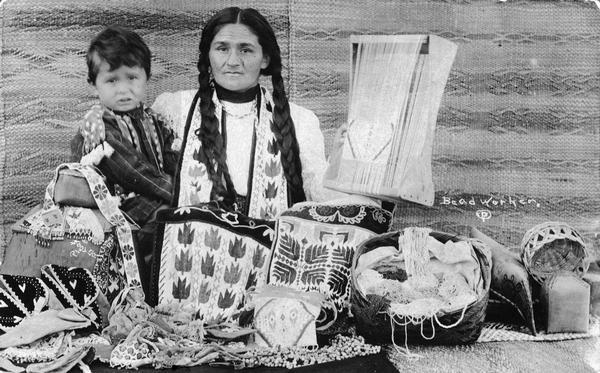 Chippewa (Ojibwa) woman with child.