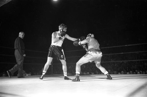Unidentified (Charlie Mohr?) University of Wisconsin boxer, during a boxing match.