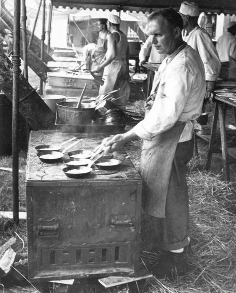 Cooks preparing food for fellow workers with Ringling Brothers, Barnum and Bailey Circus.