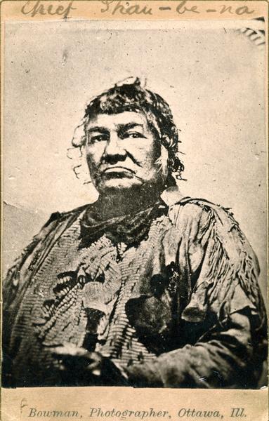 A formal photographic portrait of the Potowatomi chief Shab-eh-nay (Shau-be-na, or Shabbona), who died in 1859. Shab-eh-nay was photographed shortly before his death, but this print was made from a later copy negative. This image is part of an exhibit about Native Americans prepared by Paul Vanderbilt, the Wisconsin Historical Society's first curator of photography.