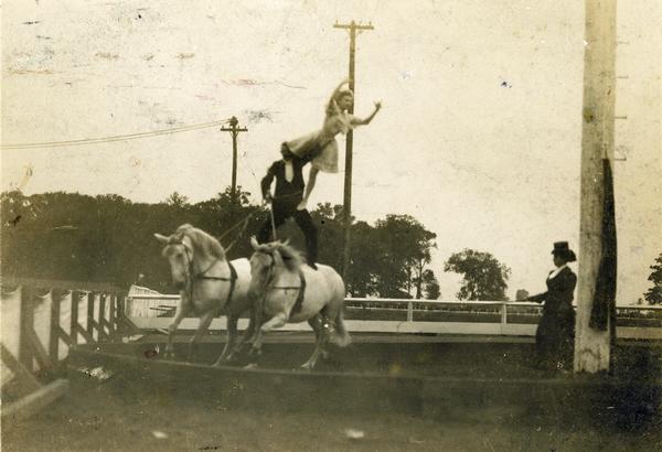 Frank B. Miller's two-horse act at a fair.