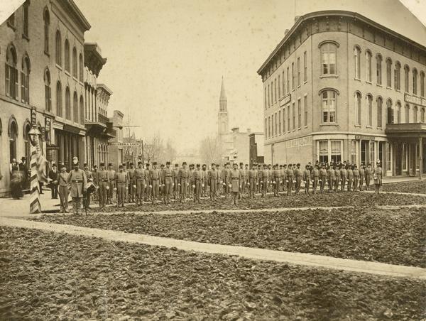 The Guppey Guard, a Wisconsin state militia unit, in formation on a street in Portage.