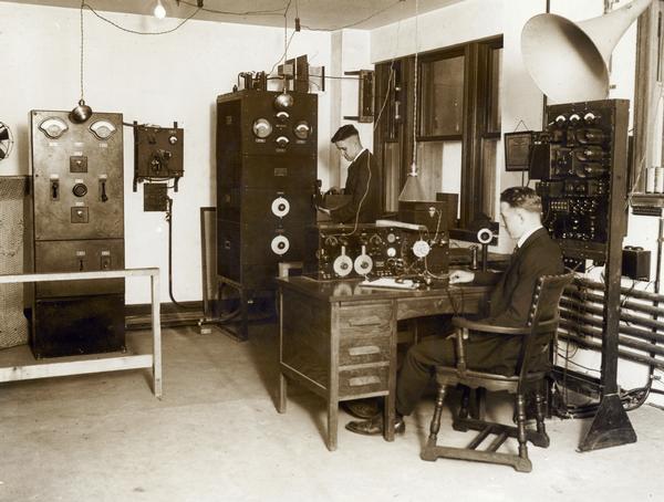 Interior of WMAQ Radio Station with Chief Engineer Donald Weller standing.