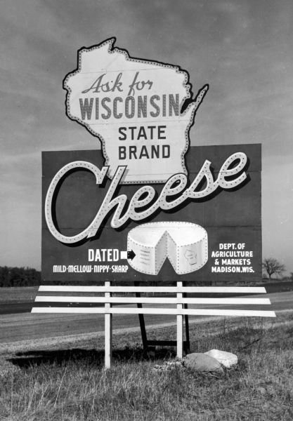 Highway billboard advertising Wisconsin cheese for the Department of Agriculture and Markets.