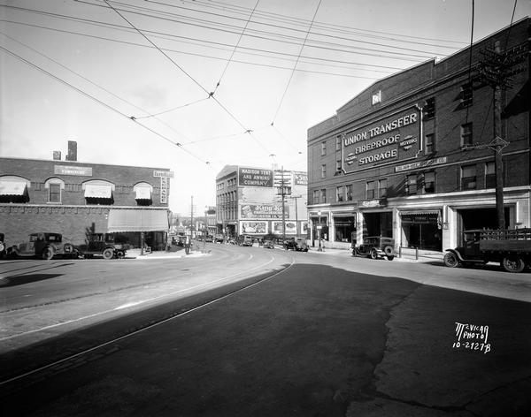 View down East Wilson Street from the corner of King Street. The Union Transfer Building is on the right hand side at 155-303 East Wilson Street, Rubin's Furniture is at 302-4 East Wilson Street, and Madison Tent and Awning is at 313 East Wilson Street.