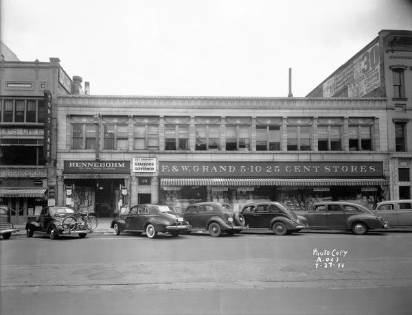 The Art Deco, Egyptian-influenced facade of the Levitan Building at 15, 17, & 19 West Main Street, including the F&W Grand 5&10 cent store, Rennebohm Drugstore #3, Cop's Cafe, and the state headquarters of Progressive gubernatorial candidate Harold E. Stafford.