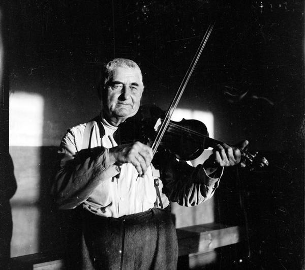 Fiddle player Emil Boulanger played for dances since he was a boy. He played entirely by ear, and on a violin which he made himself. He was born in Dyckesville (a Belgian community) and neither spoke nor understood English.
