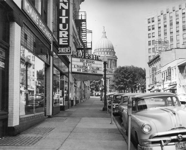 King Street, looking past the Majestic Theater, with the Wisconsin State Capitol in the background.