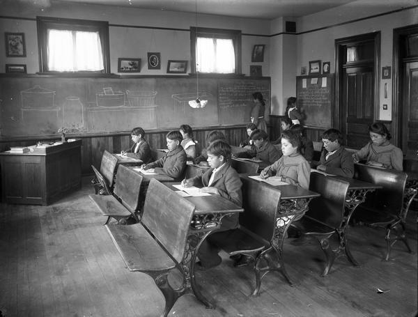 Oneida children seated at their desks in a classroom.