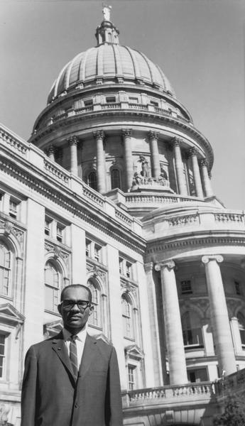 Lloyd Barbee posing in front of the Wisconsin State Capitol.